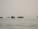Vessels are anchored in the Strait of Hormuz, as seen from Musandam, Oman.