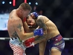 Jun 14, 2026; Washington, D.C., UNITED STATES; Ilia Topuria (red gloves) fights Justin Gaethje (blue gloves) during UFC Freedom 250 at White House South Lawn. Mandatory Credit: Amber Searls-Imagn Images