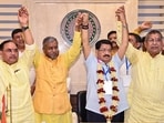 Jharkhand Assembly LoP Babulal Marandi and state BJP President Aditya Sahu join hands with the newly elected NDA-supported Independent candidate Parimal Nathwani. Jharkhand Assembly LoP Babulal Marandi and state BJP President Aditya Sahu join hands with the newly elected NDA-supported Independent candidate Parimal Nathwani.
