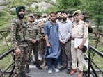 Pakistan national Asad Khan from Khyber Pakhtunkhwa, who inadvertently crossed the Line of Control (LoC) into Kupwara district on June 12, being handed back to Pakistan army officials at the Teetwal Bridge crossing point on Thursday .