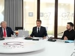 US President Donald Trump, France's President Emmanuel Macron and Ukraine's President Volodymyr Zelensky take part in a working session at the G7 summit in Evian-les-Bains, central-eastern France on June 16