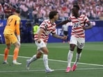 Christian Pulisic and Folarin Balogun celebrate during a 4-1 victory over Paraguay.