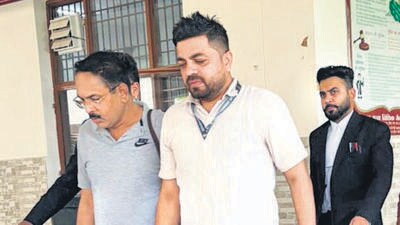 Suspended IAS officer Ram Kumar Singh (in grey shirt) being produced in a local court on Friday. (HT Photo) Suspended IAS officer Ram Kumar Singh (in grey shirt) being produced in a local court on Friday. (HT Photo)