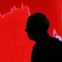 FILE PHOTO: FILE PHOTO: A man looks at a screen displaying news of markets update inside the Bombay Stock Exchange building in Mumbai, India, February 11, 2016. REUTERS/Danish Siddiqui/File Photo/File Photo(REUTERS)