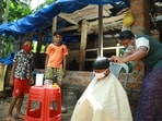 A barber in Malappuram, Kerala cutting hair during the Covid lockdown in 2021. (Shutterstock)