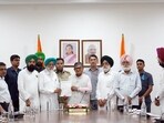 A delegation of Sanyukt Kisan Morcha’s Punjab unit handing over a memorandum of demands to governor Gulab Chand Kataria in Chandigarh on Friday. (HT)