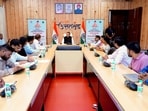 Uttarakhand Chief Minister Pushkar Singh Dhami chairs a meeting over the financial assistance to the beneficiaries of various schemes and the progress of various development projects, in Dehradun on Saturday.