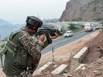 An armed CRPF official keeps a vigil on the Jammu–Srinagar Highway (NH-44) ahead of the Amarnath Yatra, in Udhampur on Friday. (ANI)