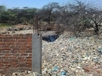 HT found broken, tilted and incomplete wall sections, with a leachate pond amid waste. MCG said it will inspect the site and act if violations are found. (HT Photo)