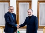 Iranian Foreign Minister Abbas Araghchi, right, shakes hands with Pakistan's Interior Minister Mohsin Naqvi, during their meeting in Tehran, Iran, Saturday, June 20, 2026.