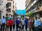 Mumbai, India. June 11, 2026 - Residents of the Shahu Nagar area, outside their buildings in the Dharavi redevelopment, were asked to shift out of the building during the week. Mumbai, India. June 11, 2026. (Photo by Raju Shinde/HT Photo) (Raju Shinde)