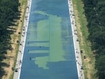 In an aerial view from the Washington Monument, crews remove algae from the bottom of the Lincoln Memorial Reflecting Pool after recent renovations following a directive from U.S. President Donald Trump to paint it blue.