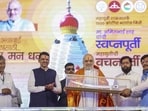 Union home minister Amit Shah greeted during a programme at the Shri Mahalakshmi (Ambabai) Temple premises, in Kolhapur, Maharashtra. Chief minister Devendra Fadnavis and deputy CM Eknath Shinde are also seen. There is only one Shiv Sena at present, which is headed by Maharashtra deputy chief minister Eknath Shinde, said Shah. (PTI)