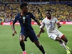 Vinicius Junior #7 of Brazil controls the ball under pressure from Carlens Arcus #2 of Haiti during the FIFA World Cup 2026 Group C match between Brazil and Haiti at Philadelphia Stadium. (AFP)