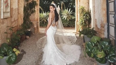 Dua Lipa was the ultimate cool-girl bride in a beautiful gown which also featured a feather-detailed headpiece and embroidered, long veil. 