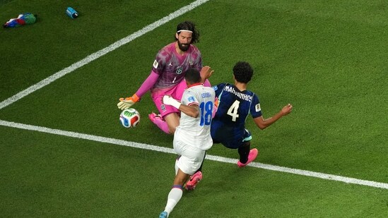 Brazil goalkeeper Alisson Becker made a save against Haiti's Wilson Isidor (18) during the World Cup Group C clash.(AP Photo)
