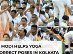 PM Modi steps in to help participants perfect their poses at int'l yoga day…