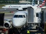 Unruly passenger bites man on American Airlines flight.
