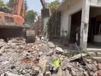 Demolition drive underway at Deha Basti area of Radaur subdivision in Yamunanagar district. (HT Photo)