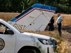Forensic technicians seen examining the wreckage of the Cessna 421 piloted by Ubisoft co-founder Claude Guillemot.