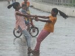 Mumbai Rain: Girls dance in the rain during monsoon shower in Mumbai. Mumbai Rain: Girls dance in the rain during monsoon shower in Mumbai.
