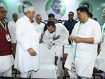 JD(U) national president Nitish Kumar gives blessing to his son and Bihar health minister Nishant Kumar during the party’s national executive meeting in Patna on Sunday. (Santosh Kumar/HT)