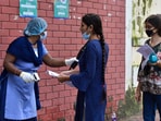 A security personnel screens a NEET aspirant before entering the exam centre. (Representative image)