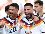 Nadiem Amiri #20 and Deniz Undav #26 of Germany celebrate the team's 2-1 victory. (Getty Images via AFP)