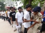 Security personnel check aspirants appearing in the NEET examination at the Magadh Mahila College in Patna on Sunday. (Santosh Kumar/HT) Security personnel check aspirants appearing in the NEET examination at the Magadh Mahila College in Patna on Sunday. (Santosh Kumar/HT)