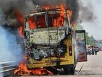 The sleeper bus in flames on the national highway near Beeja in Khanna on Sunday. Preliminary findings indicate that a technical fault may have triggered the fire. (HT Photo)
