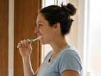 Only brush in gentle circles, per the dentist, or let an electric brush do the work for you.