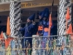 Nihangs atop a gurdwara in Rudraprayag demand release of four sect members arrested after the Chamoli clash. Nihangs atop a gurdwara in Rudraprayag demand release of four sect members arrested after the Chamoli clash.