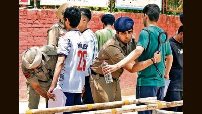 Candidates undergo frisking at an exam centre in Sector 19, Chandigarh. (Keshav Singh/HT) Candidates undergo frisking at an exam centre in Sector 19, Chandigarh. (Keshav Singh/HT)