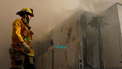 A firefighter walks down the street as a massive warehouse fire at a cold storage facility continues to burn and spread smoke around the city on June 20, 2026 in Los Angeles, California. (Photo by MARIO TAMA / GETTY IMAGES NORTH AMERICA / Getty Images via AFP) (Getty Images via AFP) A firefighter walks down the street as a massive warehouse fire at a cold storage facility continues to burn and spread smoke around the city on June 20, 2026 in Los Angeles, California. (Photo by MARIO TAMA / GETTY IMAGES NORTH AMERICA / Getty Images via AFP) (Getty Images via AFP)