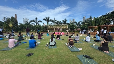 Participants practise yoga at the open-air terrace setting to mark International Day of Yoga Participants practise yoga at the open-air terrace setting to mark International Day of Yoga