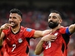 Egypt's Mahmoud Trezeguet celebrates with Mohamed Salah (right) after scoring their third goal against New Zealand. (Reuters)