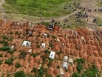 A drone view of displaced people from the Kigonze camp attending the burial of suspected Ebola victims at Nyamurongo Cemetery, one month after an outbreak was declared, in Bunia, eastern Democratic Republic of Congo, June 18, 2026.