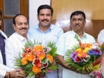 Karnataka Legislative Assembly LoP R Ashoka and state BJP president B Y Vijayendra congratulate party elected candidates Lingaraj Patil and Raghu R, who emerged victorious in the Legislative Council seats that went to polls. (Handout via PTI Photo)