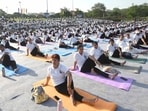 People take part in a yoga event in Sector 17, Chandigarh, on Sunday. (Keshav Singh/HT)