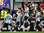 Argentina's Lionel Messi celebrates scoring their first goal with Enzo Fernandez, Facundo Medina and Thiago Almada