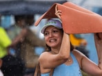 iiMumbai, India - June 21, 2026: People make their way through a light drizzle along Juhu Beach in mumbai, India, on Sunday, June 21, 2026. (Photo by Satish Bate/ Hindustan Times) (Hindustan Times)
