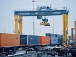 A crane loads containers at Union Pacific's Global 2 intermodal terminal in Northlake, Ill.