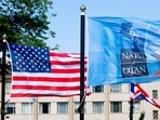 The US and NATO flags flutter ahead of a NATO summit in The Hague in June, last year. 