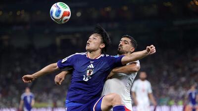 Japan's forward #18 Ayase Ueda and Tunisia's defender #21 Mohamed Ben Hamida vie for the ball during their World Cup game. (AFP) Japan's forward #18 Ayase Ueda and Tunisia's defender #21 Mohamed Ben Hamida vie for the ball during their World Cup game. (AFP)