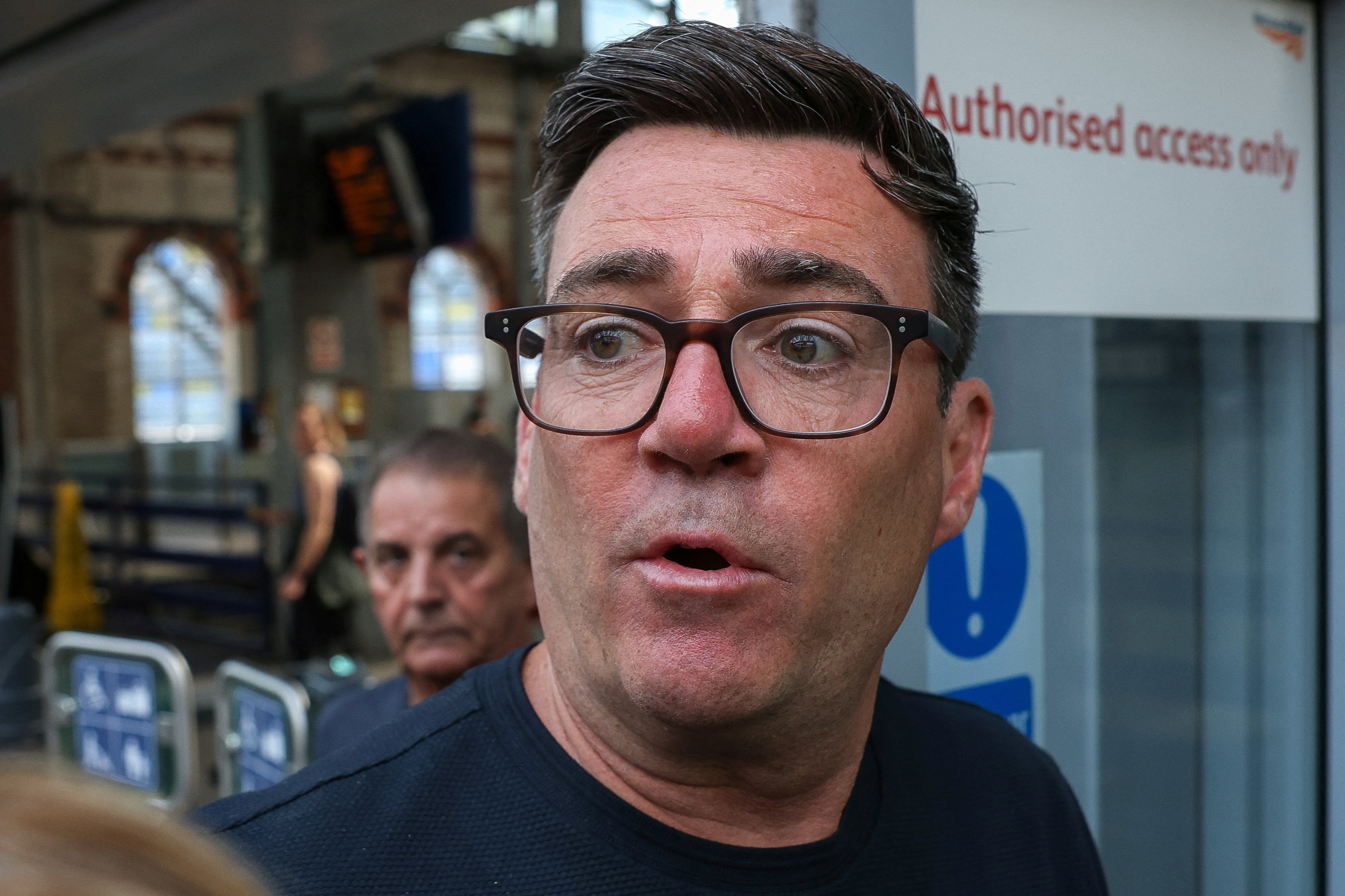 Newly elected Makerfield MP and former Greater Manchester mayor Andy Burnham walks at Manchester Piccadilly station as he leaves for London, in Manchester on June 22, 2026.  (Temilade Adelaja/Reuters Photo)