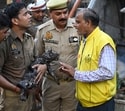 A cat being rescued by officials on Monday(Deepak Gupta/HT)