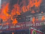 A massive fire gutted a three-floor commercial building housing an animation centre at Aliganj area in Lucknow on Monday (Deepak Gupta/HT)
