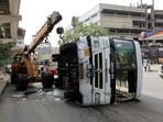 An Uttarakhand Roadways bus arriving from Rishikesh overturned after hitting a roadside divider near New Bus Adda in Ghaziabad, officials said. (Sakib Ali/HT Photo)