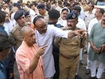 Chief minister Yogi Adityanath along with deputy CM Brajesh Pathak inspected the site of the fire incident at the commercial building housing an animation centre in Lucknow, on Monday. (HT photo)