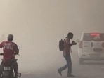 Commuters wade through a heavy dust storm during afternoon hours, in Noida on Tuesday. (ANI Video Grab) Commuters wade through a heavy dust storm during afternoon hours, in Noida on Tuesday. (ANI Video Grab)